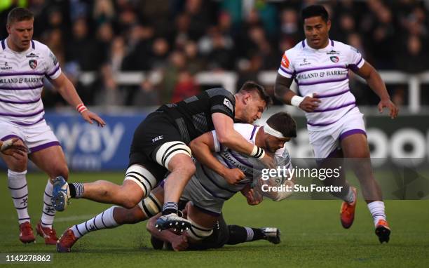 Falcons player Calum Green tackles Mike Williams of the Tigers during the Gallagher Premiership Rugby match between Newcastle Falcons and Leicester...