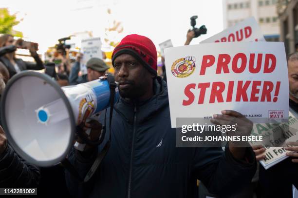 Drivers take part in a rally demanding more job security and livable incomes, at Uber and Lyft New York City Headquaters on May 8, 2019. - Rideshare...