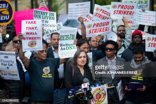 Drivers take part in a rally demanding more job security and livable incomes, at Uber and Lyft New York City Headquaters on May 8, 2019. - Rideshare...