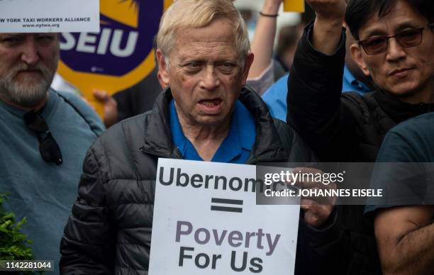 Drivers take part in a rally demanding more job security and livable incomes, at Uber and Lyft New York City Headquaters on May 8, 2019. - Rideshare...