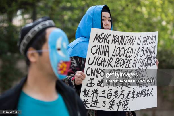 Dilibar Yusuf, a Uyghur from the Kashgar region of China, living in Surrey, British Columbia, protests China's treatment of Uyghurs outside a court...