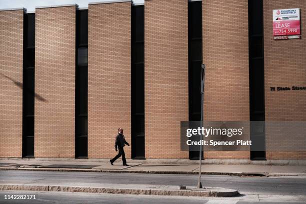 Man walks through the city on April 11, 2019 in Binghamton, New York. Due to an aging population, falling birthrates and slowing immigration, America...