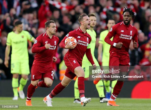 Liverpool's Jordan Henderson celebrates after Divock Origi scored the opening goal during the UEFA Champions League Semi Final second leg match...