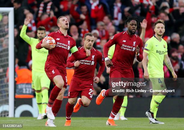 Liverpool's Jordan Henderson celebrates after Divock Origi scored the opening goal during the UEFA Champions League Semi Final second leg match...