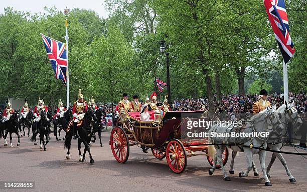 Prince William, Duke of Cambridge and Catherine, Duchess of Cambridge make the journey by carriage procession to Buckingham Palace following their...