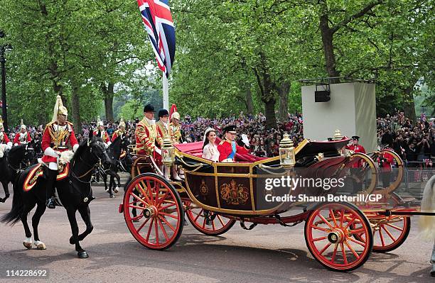 Prince William, Duke of Cambridge and Catherine, Duchess of Cambridge make the journey by carriage procession to Buckingham Palace following their...