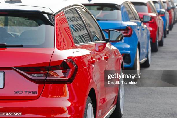 audi a1 colorful cars parked on the street - cars parked in a row stock pictures, royalty-free photos & images