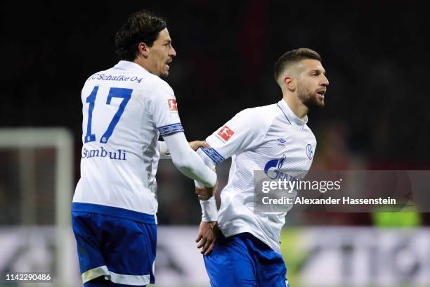 Matija Nastasic of FC Schalke 04 celebrates with his team mate after Benjamin Stambouli scoring his team's first goal during the Bundesliga match...