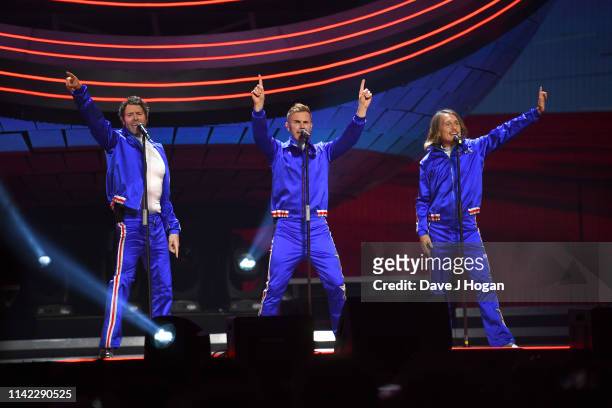 Take That perform on stage at the FlyDSA Arena on April 12, 2019 in Sheffield, England.