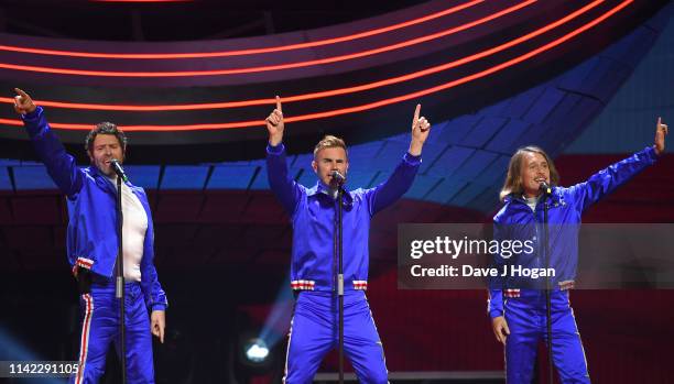 Take That perform on stage at the FlyDSA Arena on April 12, 2019 in Sheffield, England.