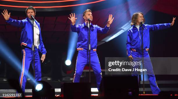 Take That perform on stage at the FlyDSA Arena on April 12, 2019 in Sheffield, England.