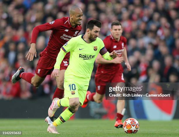 Barcelona's Lionel Messi gets away from Liverpool's Fabinho during the UEFA Champions League Semi Final second leg match between Liverpool and...