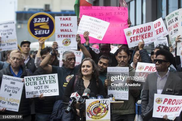 Uber, Lyft and other app based drivers participate in a rally outside of the Uber and Lyft headquarters in New York, United States on May 8, 2019.