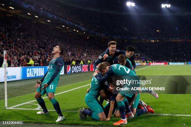 Tottenham players celebrate their victory at the end of the UEFA Champions League semi-final second leg football match between Ajax Amsterdam and...