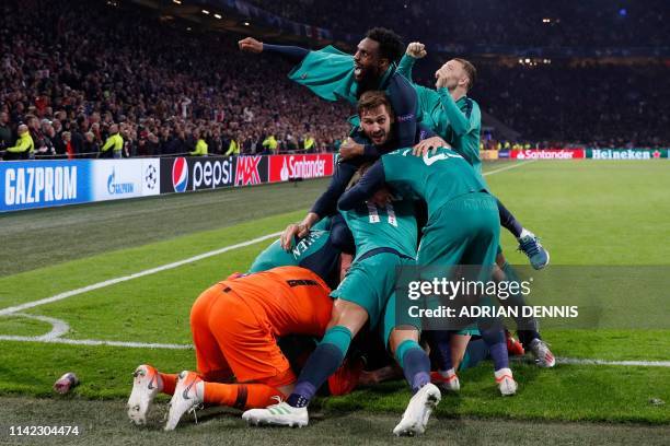 Tottenham players celebrate their victory at the end of the UEFA Champions League semi-final second leg football match between Ajax Amsterdam and...