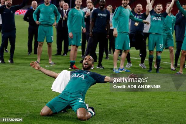 Tottenham's Brazilian forward Lucas celebrates the victory with teammates at the end of the UEFA Champions League semi-final second leg football...