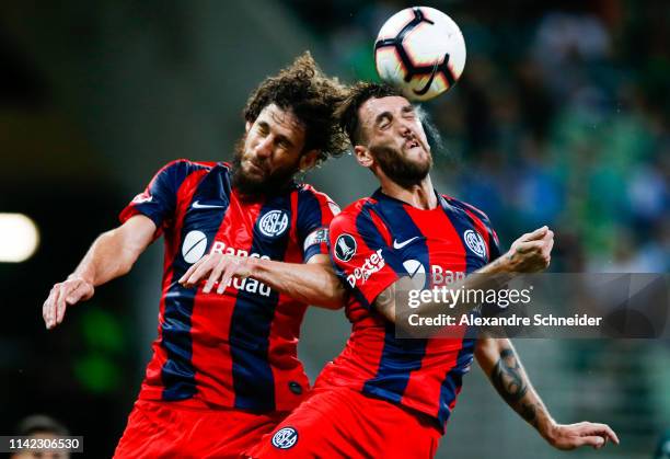 Fabricio Coloccini and Gonzalo Rodriguez of San Lorenzo go for a header during the match against Palmeiras for the Copa CONMEBOL Libertadores 2019 at...