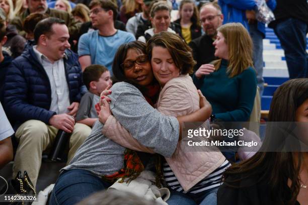Stephany Spaulding hugs Cindy Sandhu during a candlelight vigil at Highlands Ranch High School on May 8, 2019 in Highlands Ranch, Colorado. One...