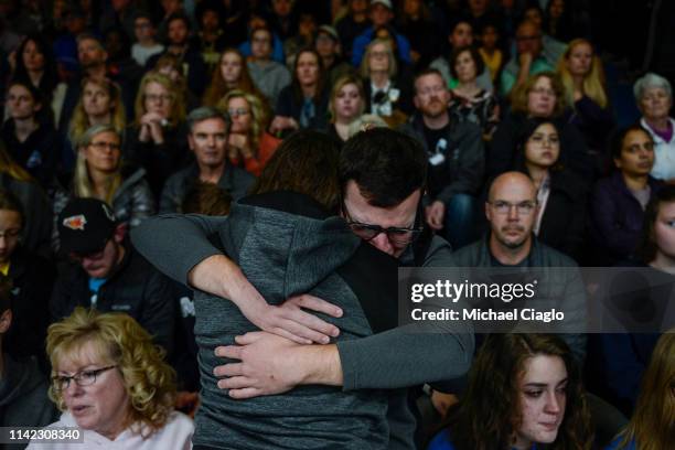 School Highlands Ranch senior Jason Hristopoulos hugs a friend during a candlelight vigil at Highlands Ranch High School on May 8, 2019 in Highlands...