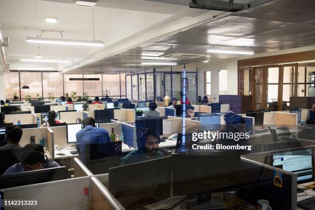 Employees work at the Zerodha Commodities Pvt. Office in Begaluru, India, on Tuesday, April 30, 2019. Thanks to a slick, mobile-friendly platform and...