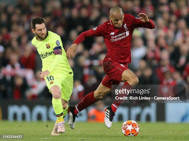 Liverpool's Fabinho gets away from Barcelona's Lionel Messi during the UEFA Champions League Semi Final second leg match between Liverpool and...