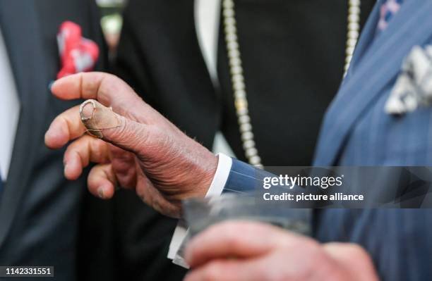 The British Prince Charles attends the Queen's Birthday Party in the residence of the Ambassador of Great Britain and gestures with his right hand,...