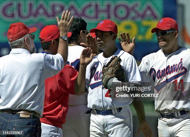 Players from the Panamanean baseball team celebrate 24 November 2002 after their victory against El Salvador with a score of 5-0. The game was played...