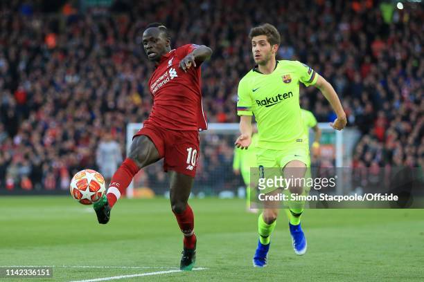Sergi Roberto of Barcelona battles with Sadio Mane of Liverpool during the UEFA Champions League Semi Final second leg match between Liverpool and FC...
