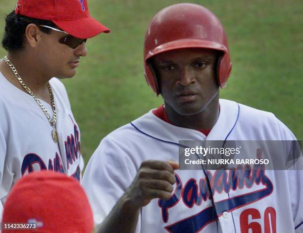 Orlando Miller of Panama, greets his teammates after batting a homerun with 3 men on base, meaning a score of 4 runs for his team during the...