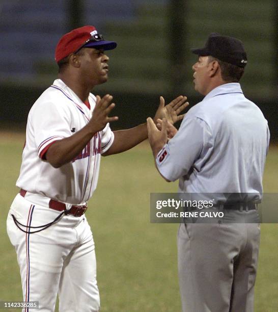 The Dominican Candelario Rodrigez , questions a call made by a referee, during the Cuba and Dominican Republic disputed on 12 November 20002 in the...