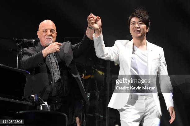 Pianist Lang Lang performs onstage with Billy Joel during Billy Joel's 63rd consecutive residency show at Madison Square Garden on April 12, 2019 in...
