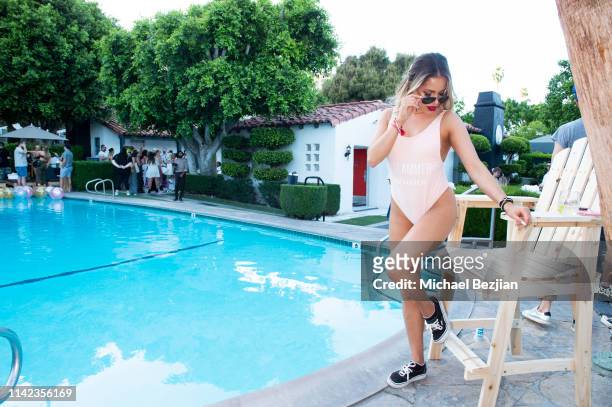 Kristina Urribarres poses for portrait poolside at beGlammed Sunset Soiree Presented by Fullscreen on April 12, 2019 in Palm Springs, California.