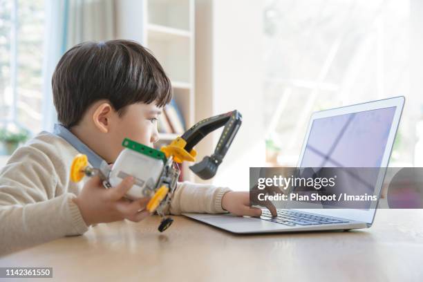 a child learning coding (programming) - kid coding stock pictures, royalty-free photos & images