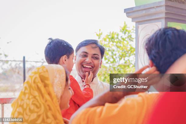 candid fun with relatives at the hindu temple - hinduism stock pictures, royalty-free photos & images