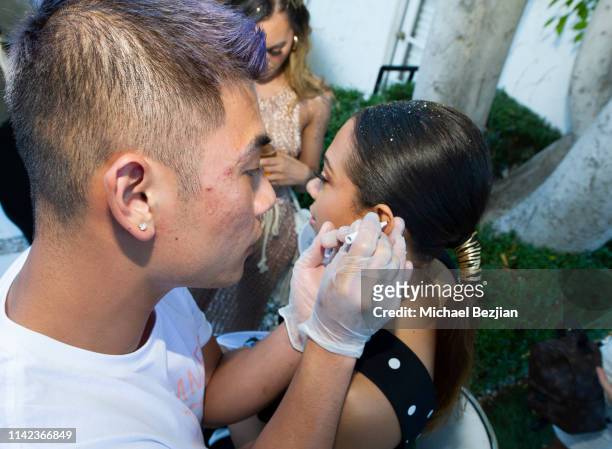 Guest getting ear pierced at beGlammed Sunset Soiree Presented by Fullscreen on April 12, 2019 in Palm Springs, California.