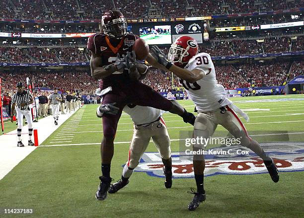 Georgia cornerback Bryan Evans defends as safety Kelin Johnson breaks up a touchdown pass intended for Virginia Tech wide receiver Josh Morgan during...