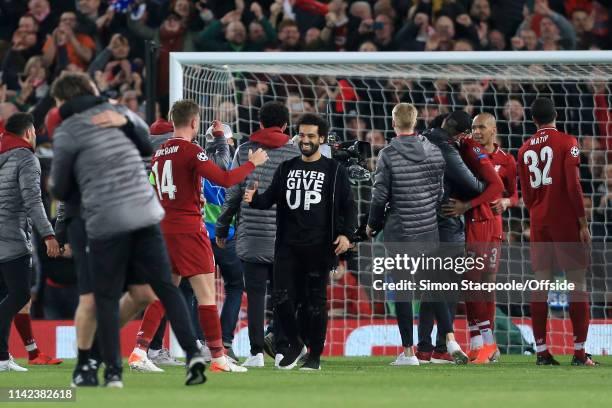 Mohamed Salah of Liverpool wears a t-shirt reading 'Never Give Up' as he celebrates with his teammates after the UEFA Champions League Semi Final...