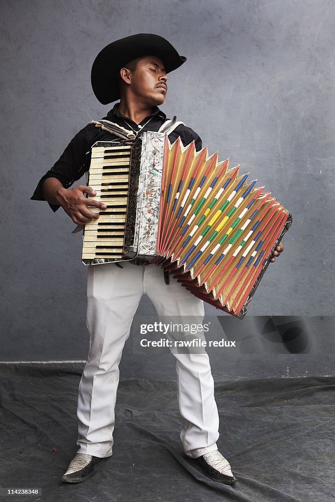 Mexican guy playing the accordion