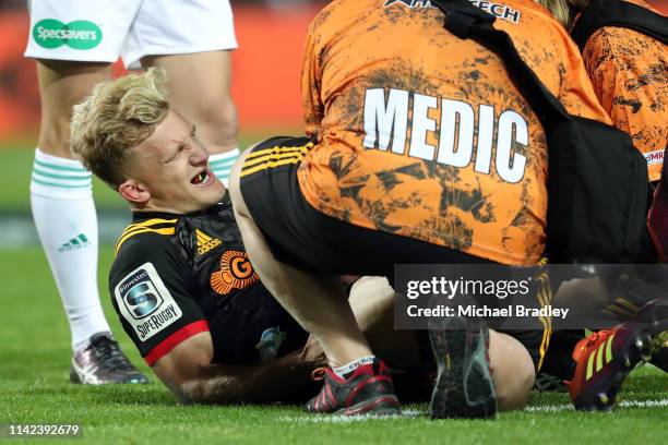 Chiefs Damian McKenzie leaves the field injured during the round 9 Super Rugby match between the Chiefs and the Blues at FMG Stadium on April 13,...