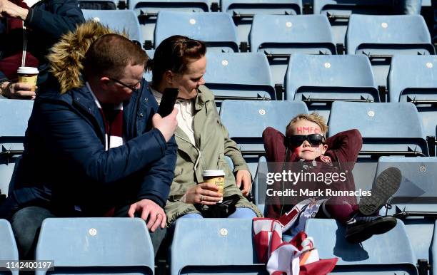 Young Heart of Midlothian F.C. Fan enjoys the pre match sun prior to the Scottish Cup Semi Final match between Heart of Midlothian and Inverness...