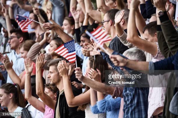 spectators on a stadium with usa playing - referendum stock pictures, royalty-free photos & images