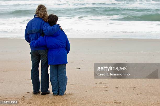 mother and son - mourner stock pictures, royalty-free photos & images