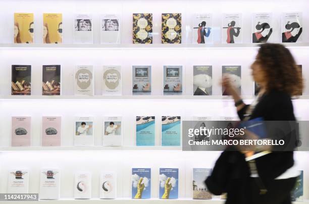 Visitor walks past a book display on May 9, 2019 at the Turin International Book Fair in Turin.