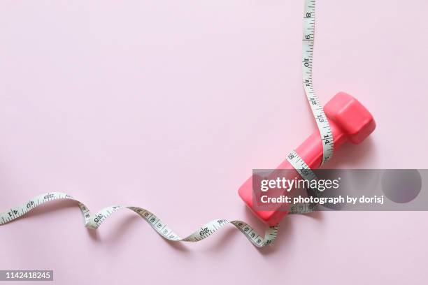 dumbbell and measure tape - centimeter stock pictures, royalty-free photos & images