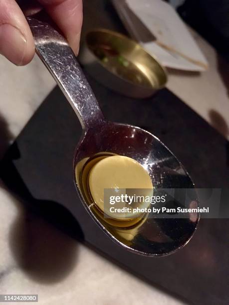 close-up of spherical olives - molecular gastronomy stock-fotos und bilder