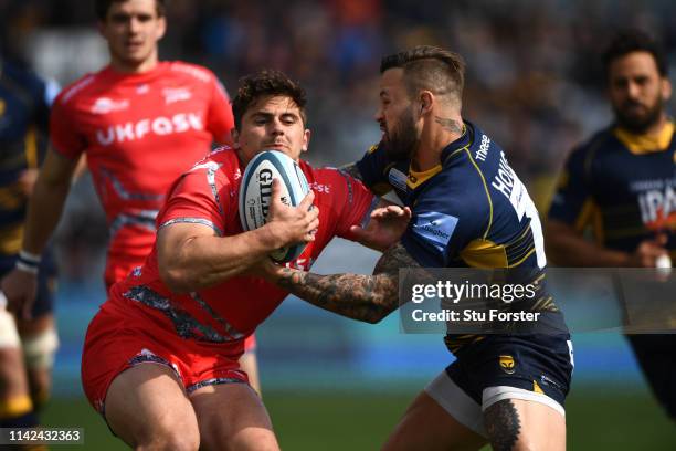 Warriors player Francois Hougaard gets to grips with Rohan Janse van Rensburg of Sale during the Gallagher Premiership Rugby match between Worcester...