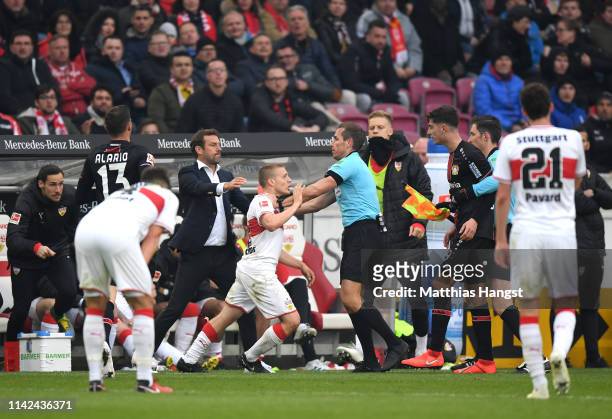 Santiago Ascacibar of VfB Stuttgart clashes with the referee during the Bundesliga match between VfB Stuttgart and Bayer 04 Leverkusen at...