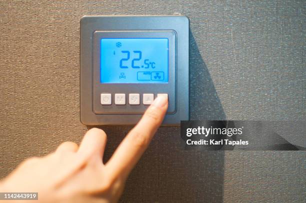 push button airconditioner remote control - turning on light switch stock pictures, royalty-free photos & images