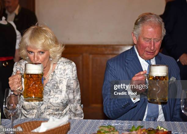 Camilla, Duchess of Cornwall and Prince Charles, Prince of Wales during their visit to the Hofbraeuhaus beer hall on May 9, 2019 in Munich, Bavaria.