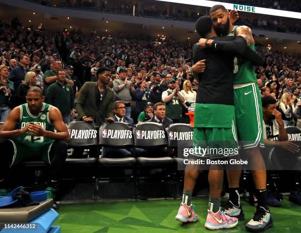 Boston Celtics guard Kyrie Irving is embraced by Boston Celtics forward Marcus Morris as time ran out on the Celtics as they fell 116-91 to the...